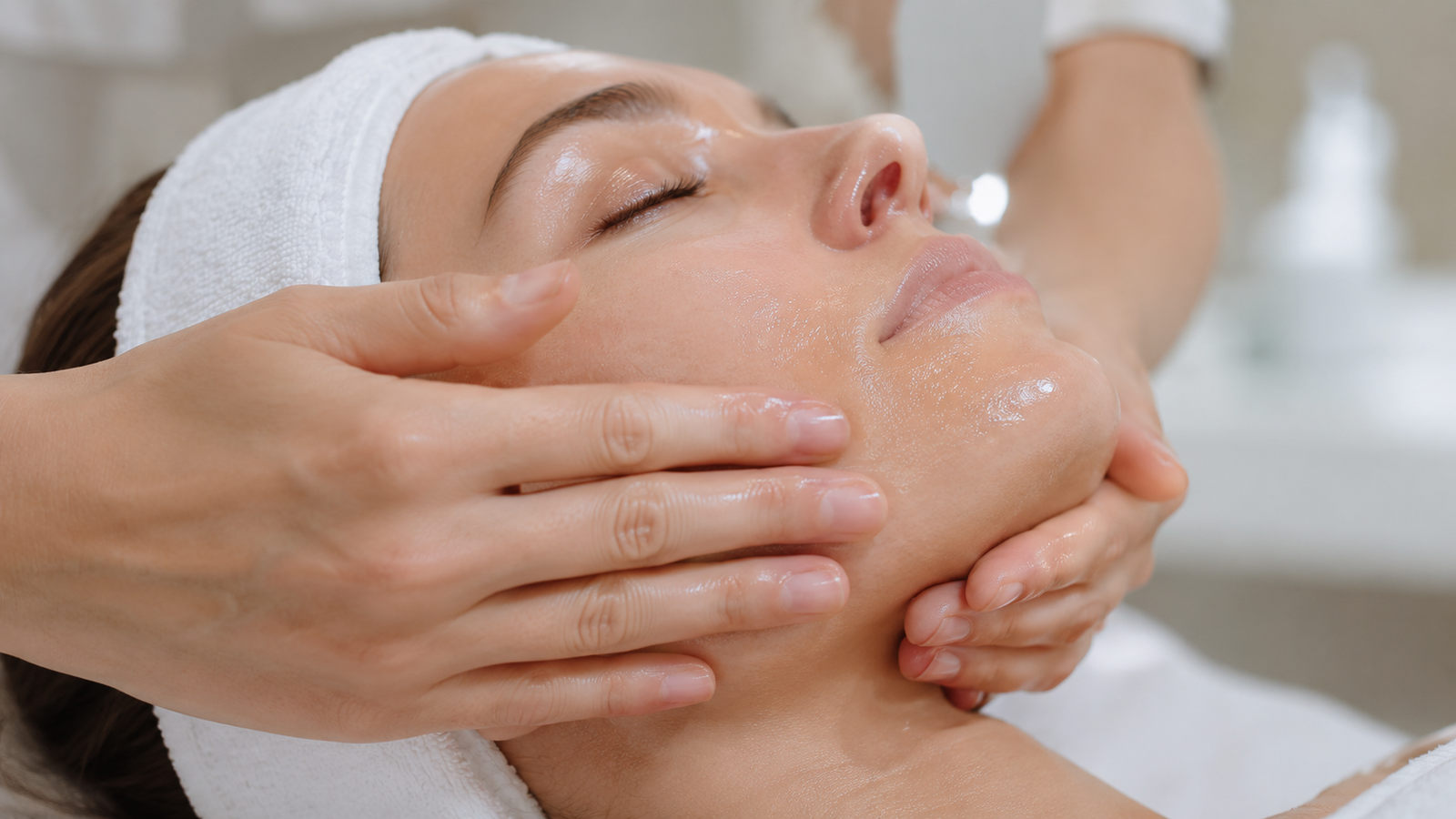 Provider massaging the PRX-T33 solution into a client's skin by hand at About Image Med Spa