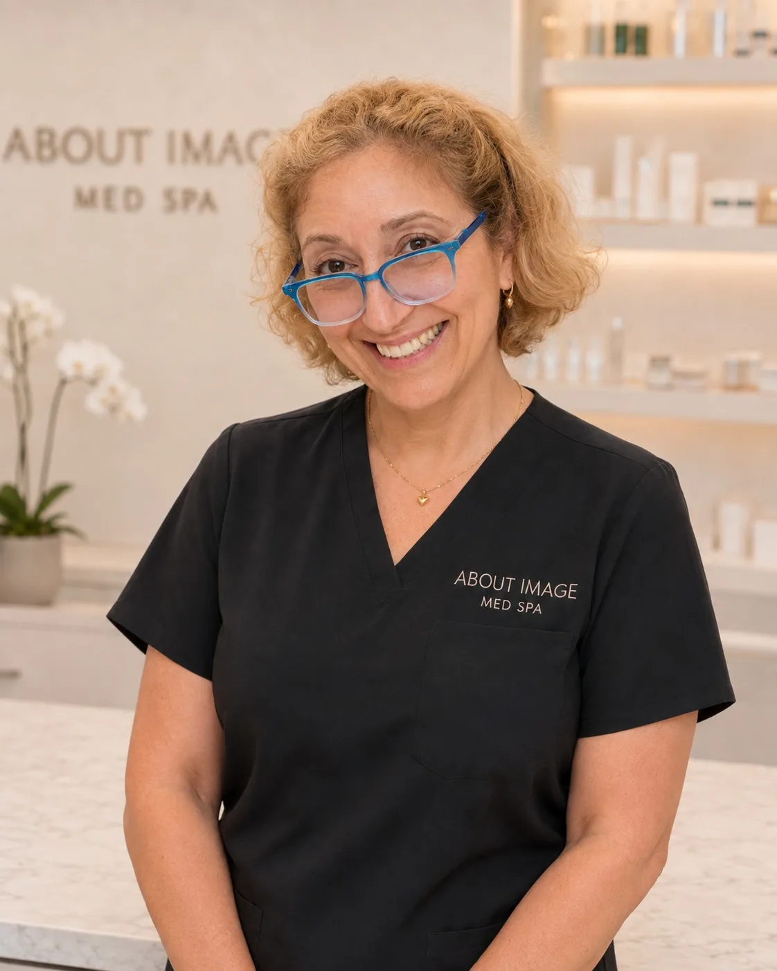 Nushan Daryabeygi, founder of About Image Med Spa, standing in the treatment studio in Oakton, Virginia